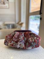 Jacquard Cloud bag showing its texturized multicolored weave pattern, soft gathers, and gold sling chain.