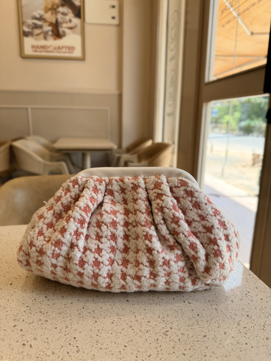 Back view of the Jacquard Cloud bag highlighting the continuous woven pattern and gather folds.