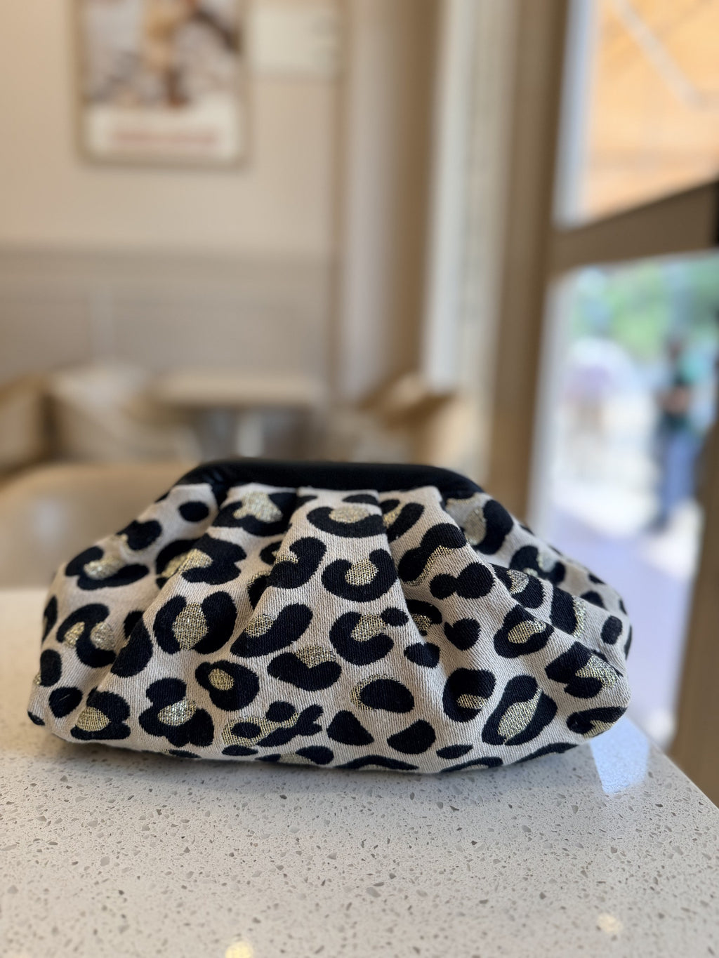 Jacquard Cloud bag opened to show the secure inner lining and spacious interior.