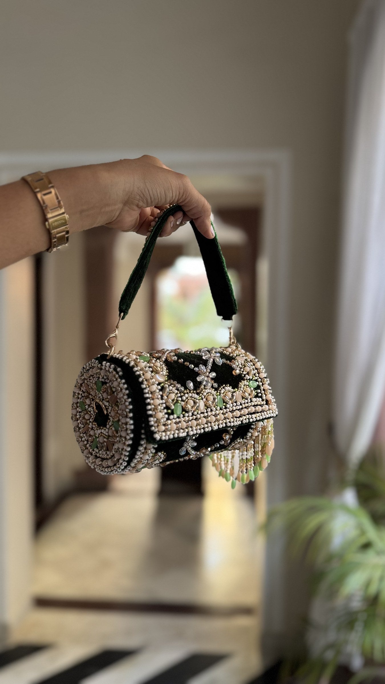 Top view of the Jadau Dreams Potli, displaying its velvet wristlet loop.