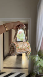 Open view of the Jadau Dreams Potli showing the spacious compartment and satin lining.