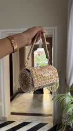 Rear panel view of the potli showing the consistent embroidery and beadwork pattern.