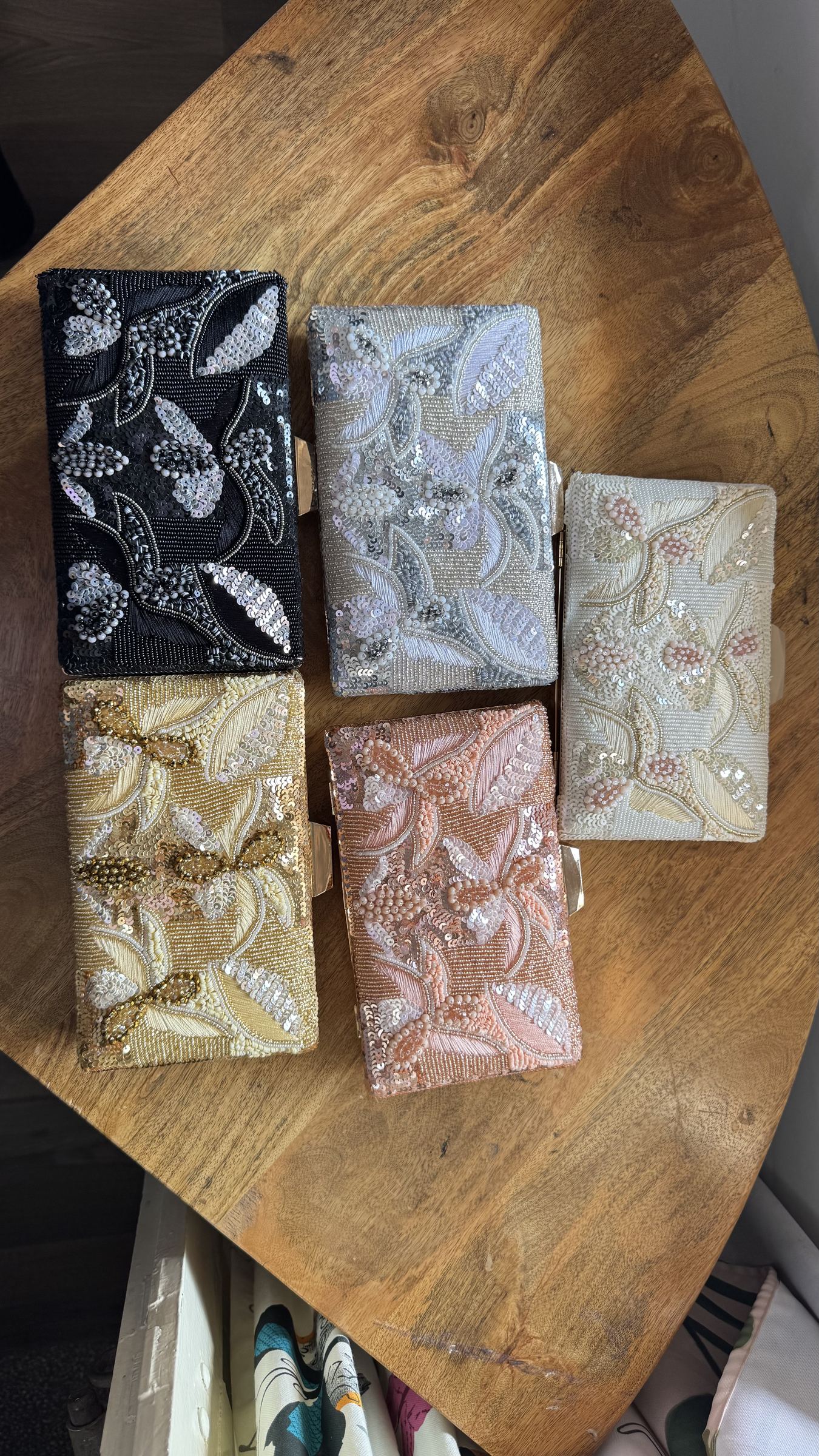 Front view of the Kiara clutch, showcasing its compact rectangular box shape.