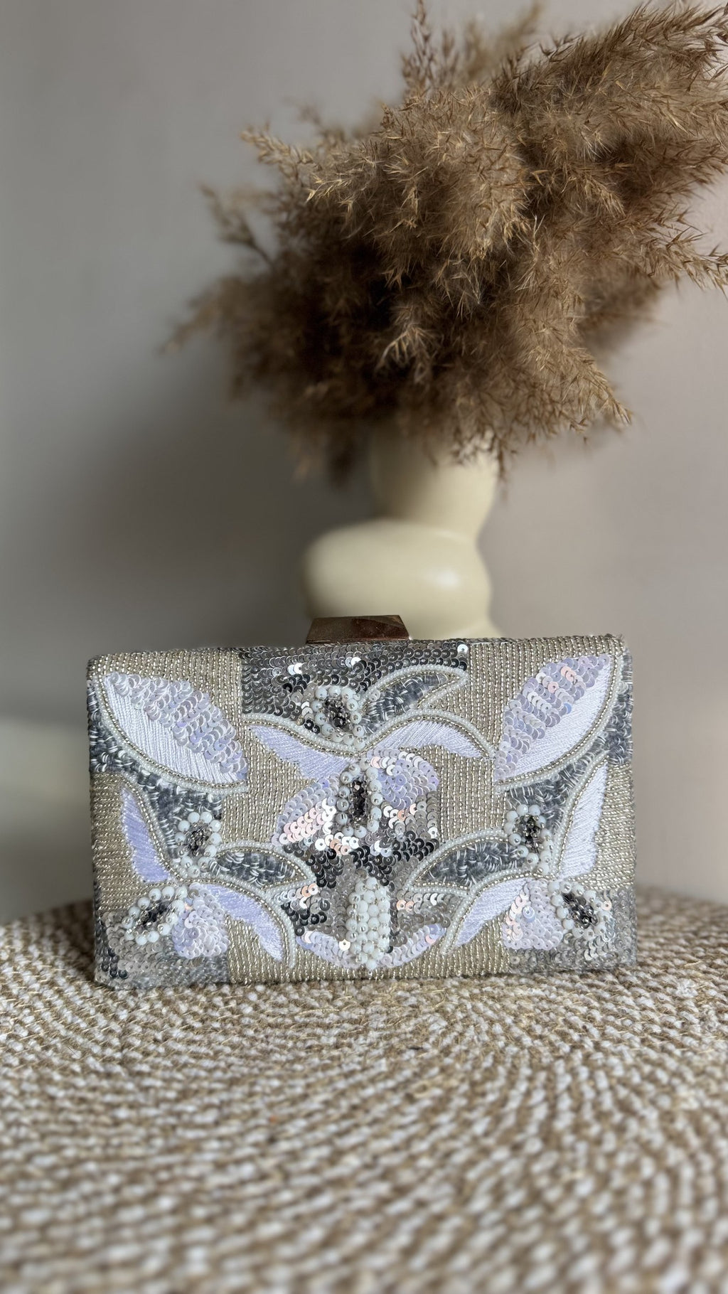 Rear view of the Kiara clutch showing the consistent fabric panel on the back.