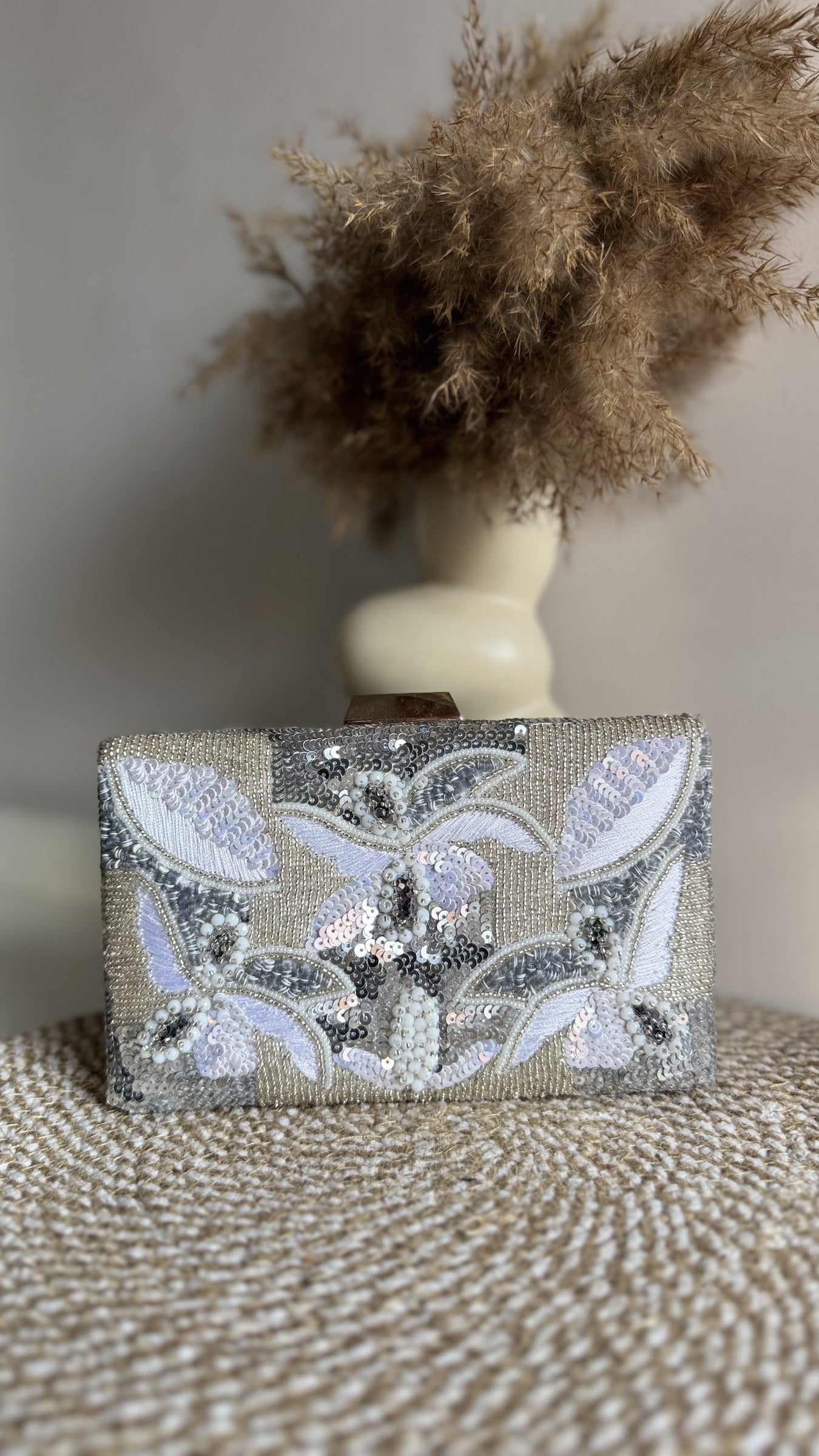 Rear view of the Kiara clutch showing the consistent fabric panel on the back.