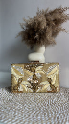 Open view of the Kiara clutch displaying its internal fabric lining.