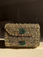 Front profile of the Kundan Peacock clutch, showcasing the symmetry of the handwork.