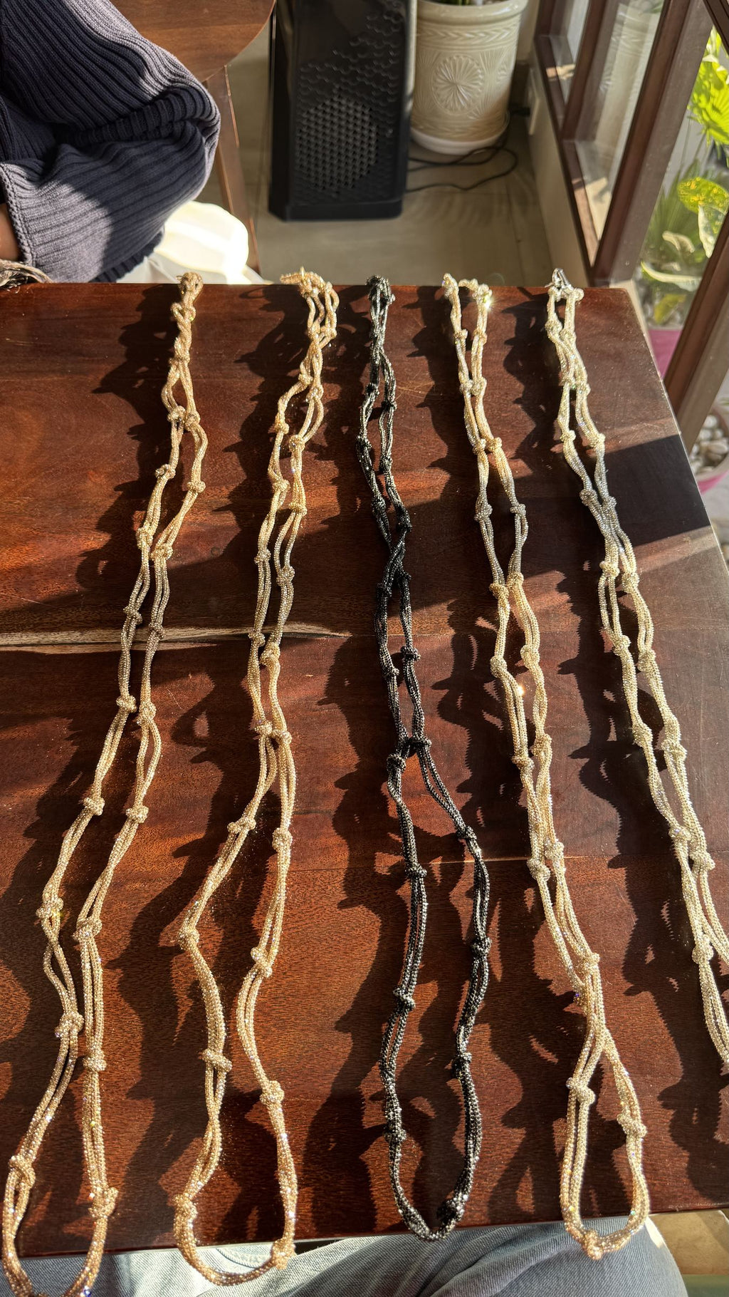 Multicolored woven fabric lanyard showing the metallic key loop closure.