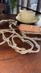 Fashion view of the lanyard styled with a neutral blazer for professional wear.