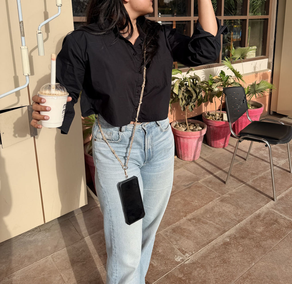 Lifestyle styling showing the lanyard hanging out of a handbag pocket.