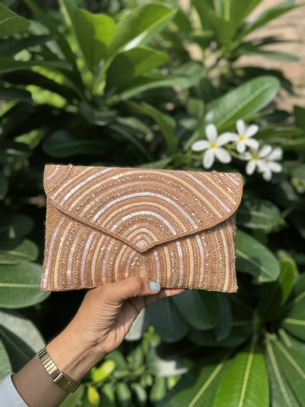 Front view of the Leher Waves flap bag, illustrating the flow of the wave-inspired bead paths.