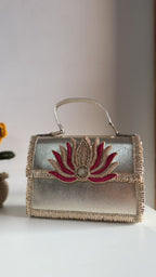 Lotus Treasure clutch in royal blue, displaying its rich color panel and borders.
