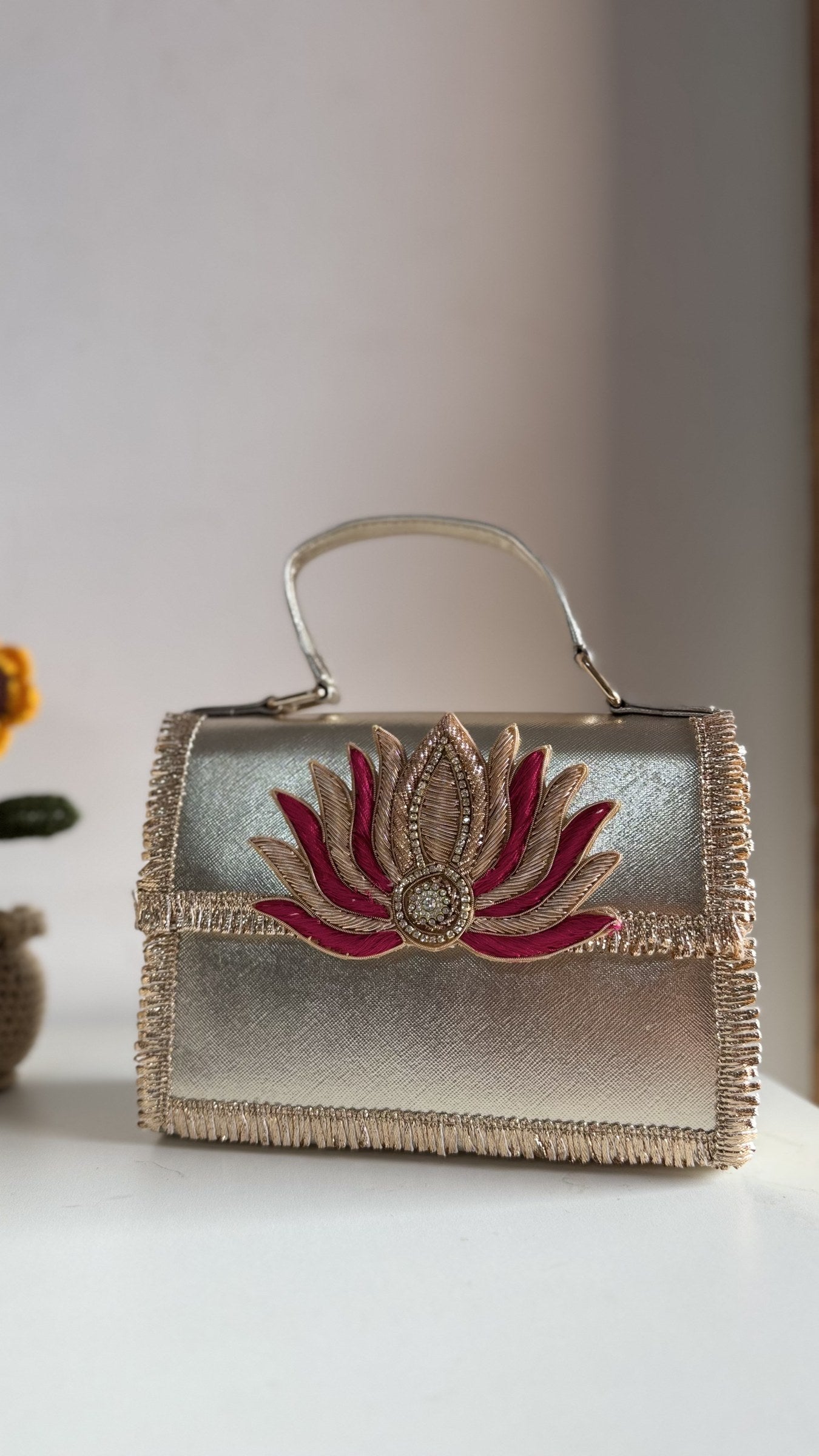 Lotus Treasure clutch in royal blue, displaying its rich color panel and borders.