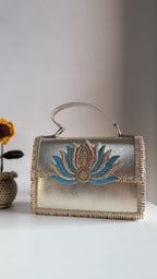 Side profile of the structured Lotus Treasure box clutch, showing its depth.