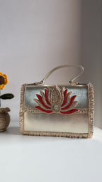 Open view of the Lotus Treasure handbag showing the fabric lining and metal hinge.