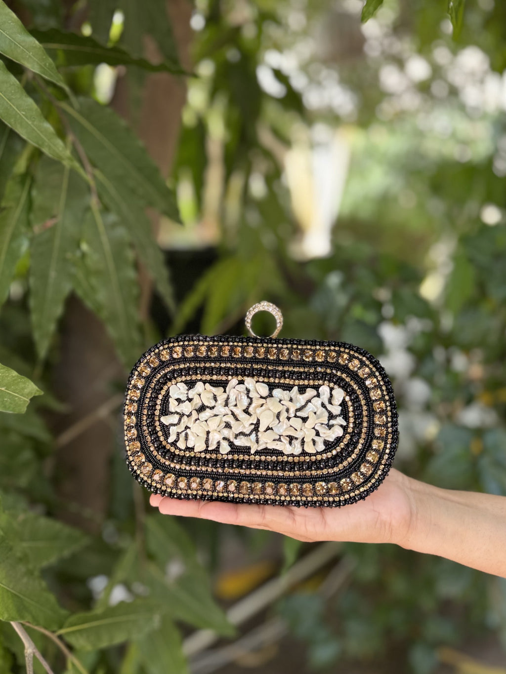 Detailed close-up of the pearls and natural jute fabric weave.