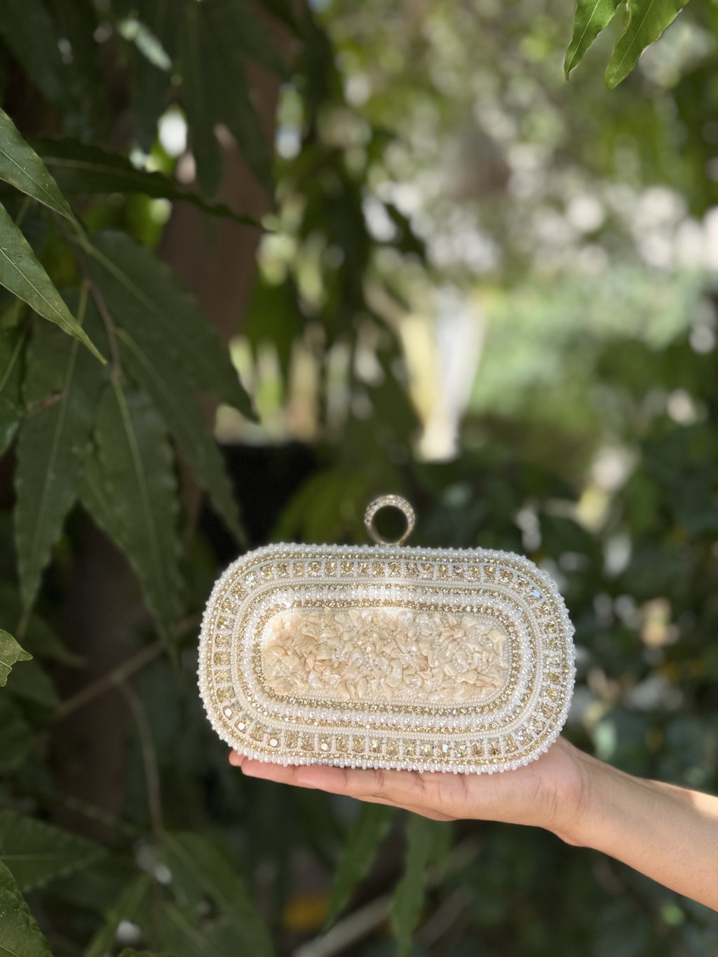 Rear view of the Luxe Grip clutch showing the consistent jute fabric layout.