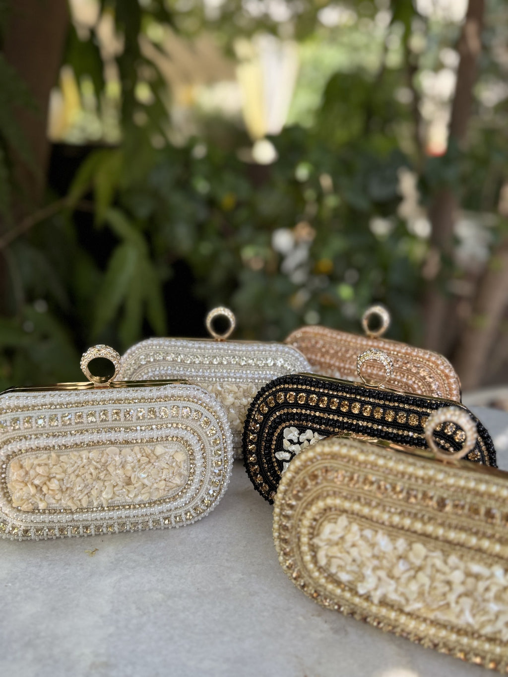 Detailed view of the gold-tone loops for the detachable sling chain.