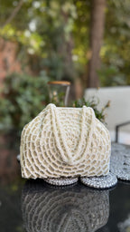 Side angle of the Mohini 3.0 clutch highlighting its structured flat base.