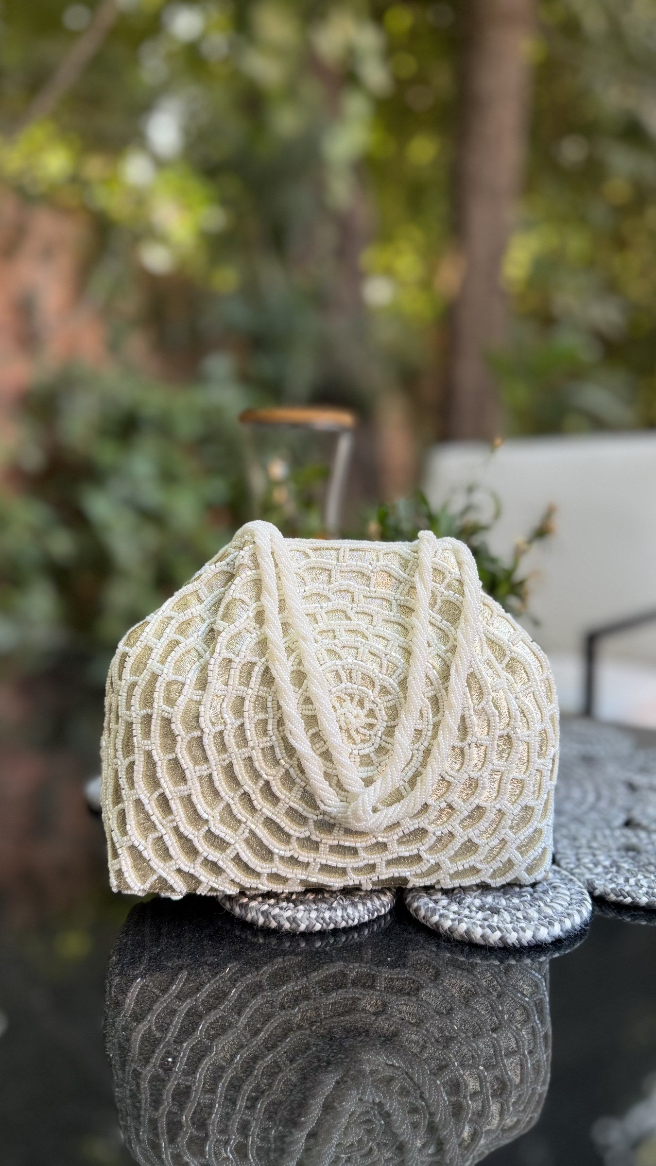 Side angle of the Mohini 3.0 clutch highlighting its structured flat base.