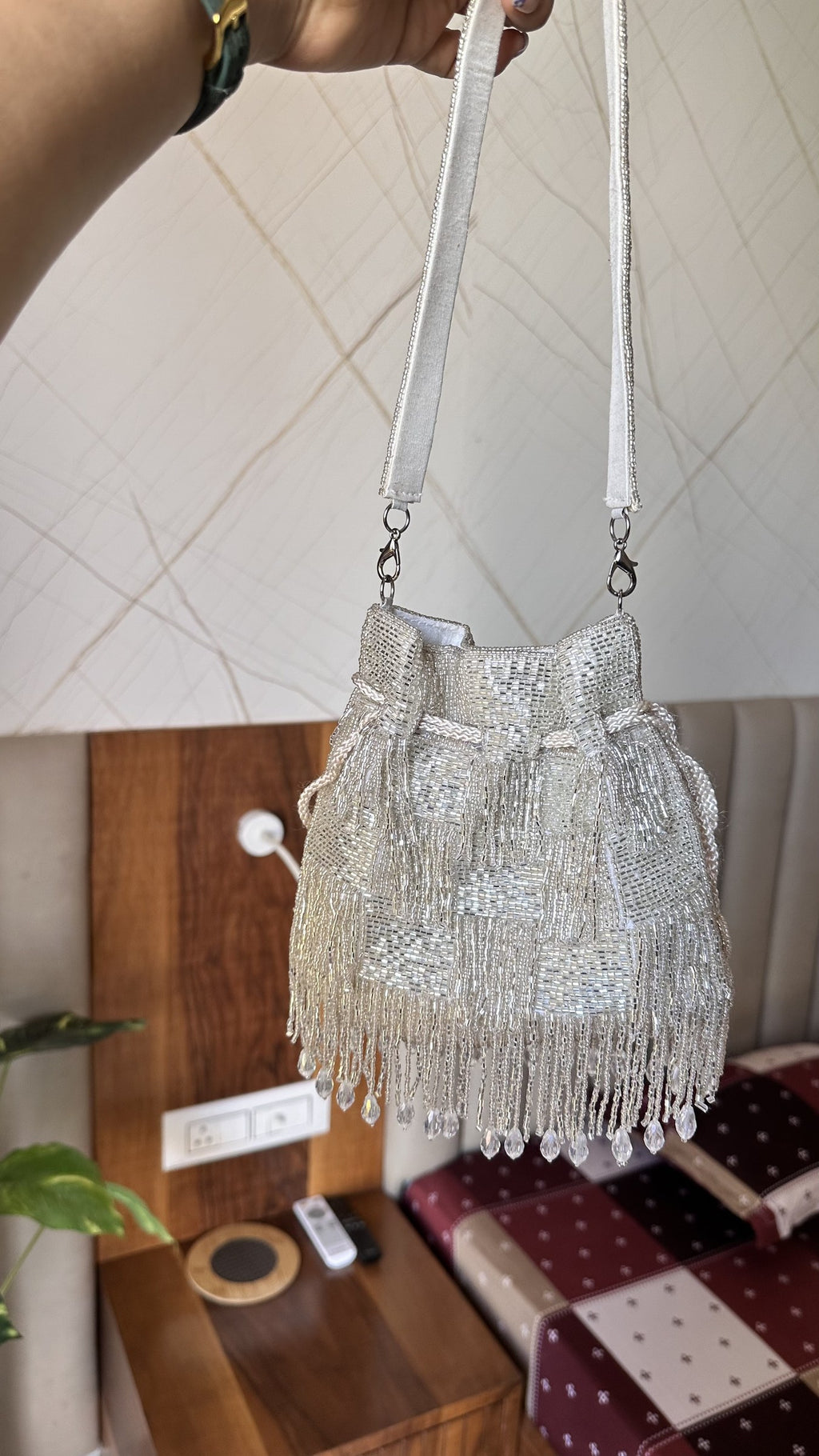Close-up of the delicate bottom seam embellishments on the Majestyy Potli.