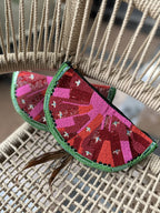 Close-up of the textured green border and red center fabric.