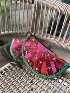 Side angle of the Melon Mood bag showing its structured width and D-rings.
