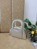 Front view of the Mini Mood Companion Sling in its multi-pastel colorway, displaying its clean zip closure.