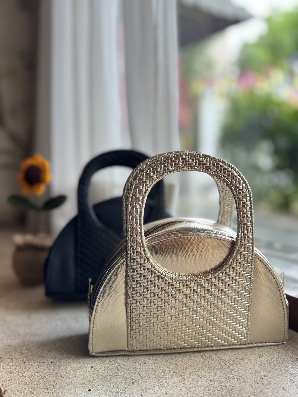 Side angle of the Mini Mood bag showing its slim, lightweight profile.