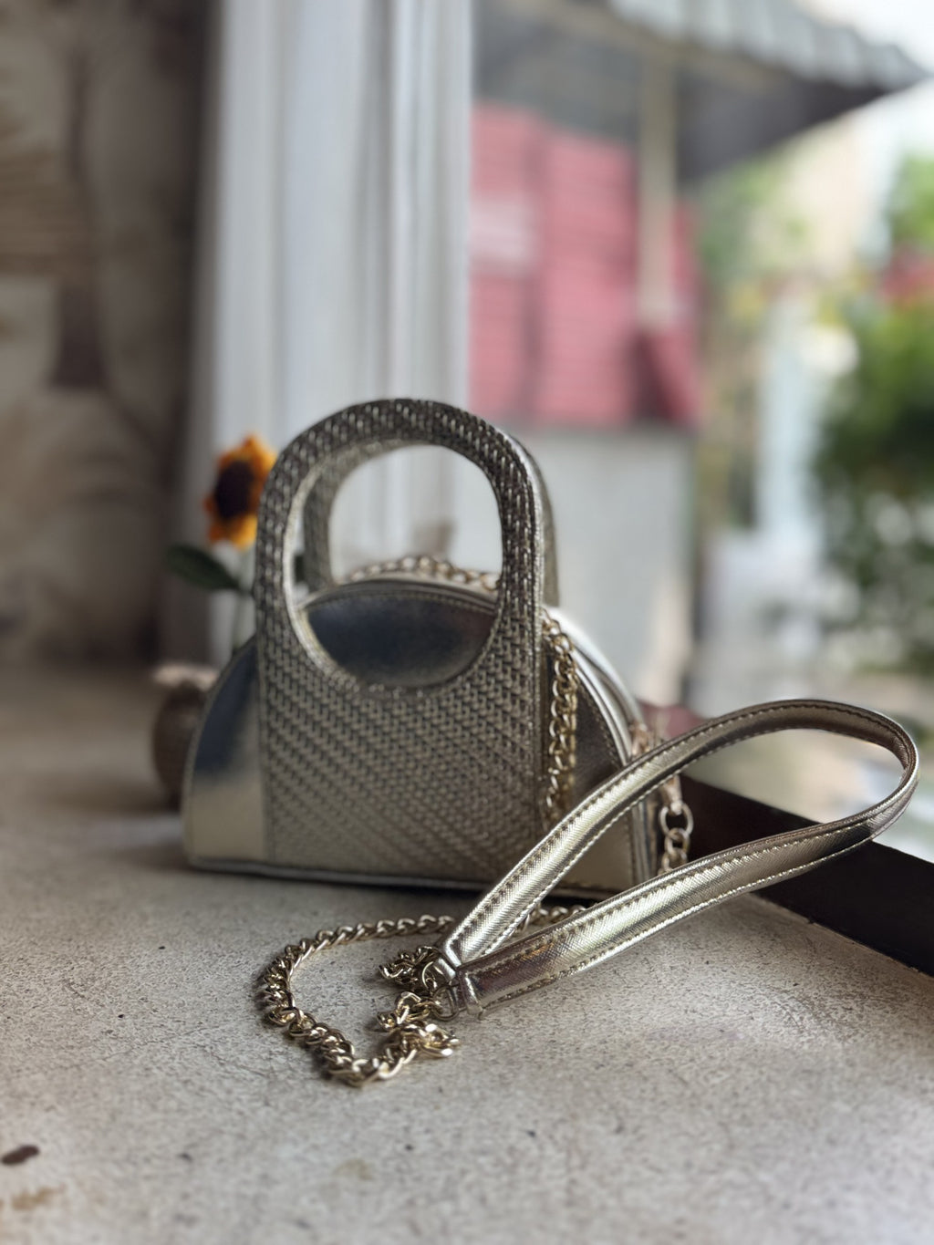 The Mini Mood sling zipped open, showing the spacious interior lining and card pocket.