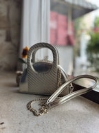 The Mini Mood sling zipped open, showing the spacious interior lining and card pocket.