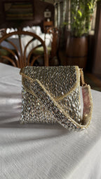 Front profile of the Mini Saanjh clutch, showcasing its compact rectangular silhouette.