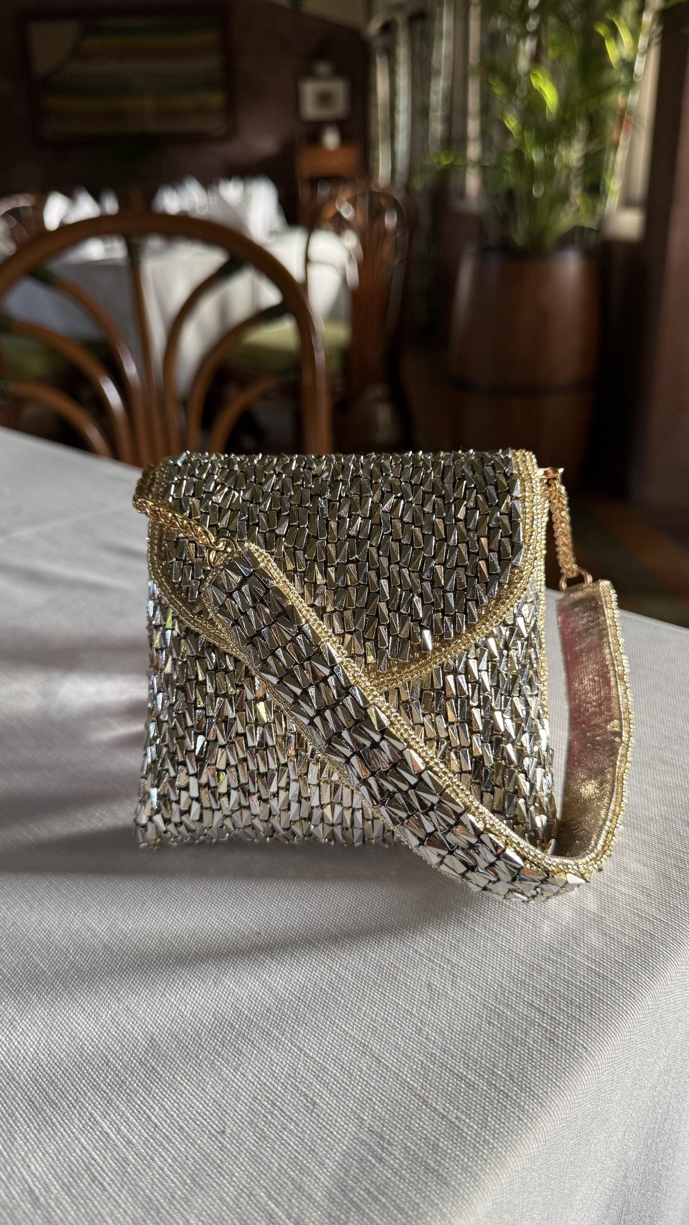 Front profile of the Mini Saanjh clutch, showcasing its compact rectangular silhouette.