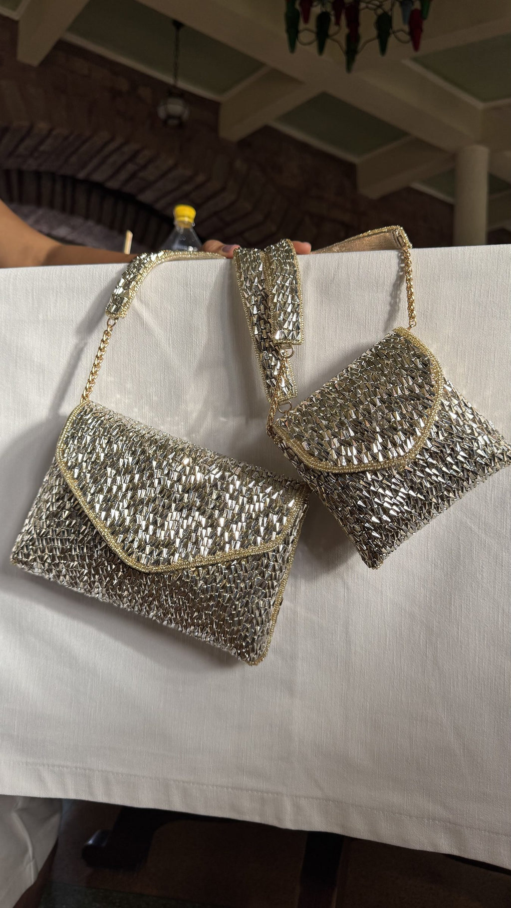 Detailed close-up of the mixed-metal silver and gold mesh wiring.