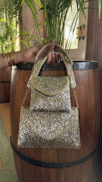 Rear view of the Mini Saanjh bag illustrating the gold and silver mesh pattern on the back.