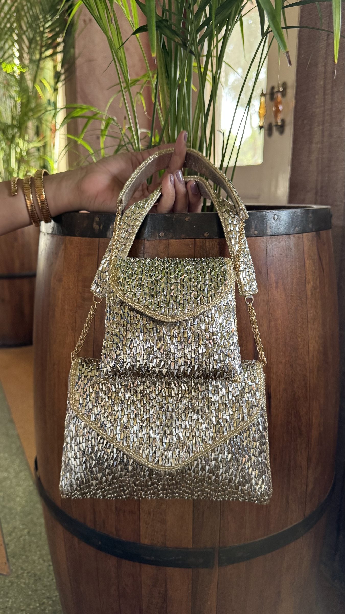 Rear view of the Mini Saanjh bag illustrating the gold and silver mesh pattern on the back.