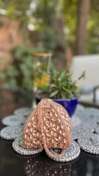 Front view of the Mini Sparkle Trunk Potli showing its structured square base and shimmering silver exterior.