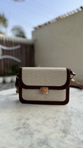 Front view of the Mocha Sling, showing the contrast between cream jute canvas and mocha-brown PU leather.