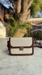 Rear angle of the Mocha Jute sling showing the clean leather back panel and buckle attachments.