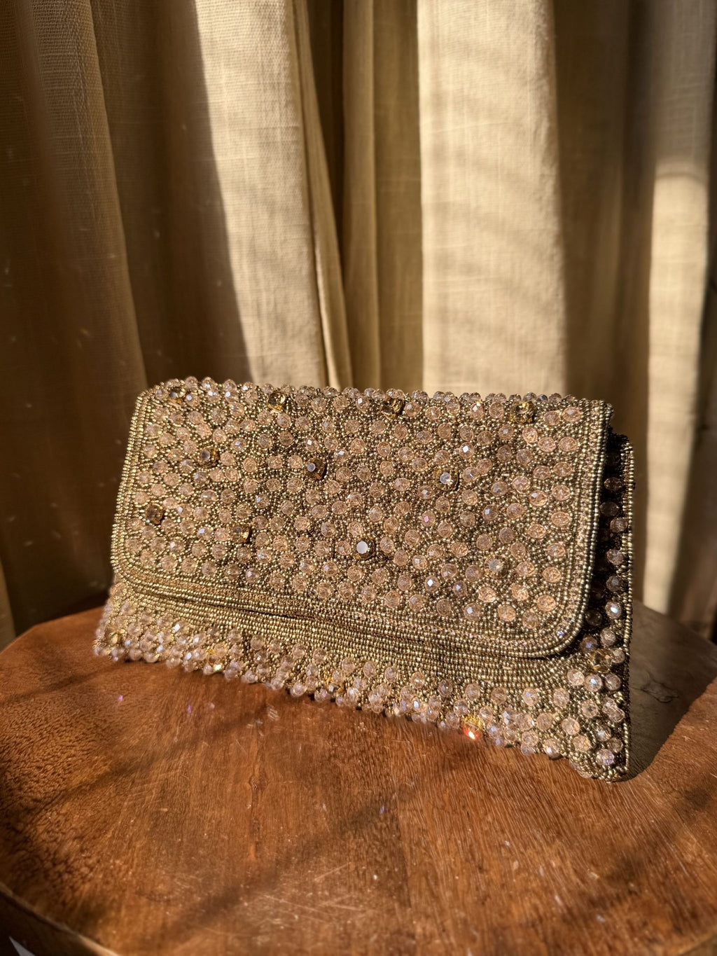 Front view of the Moonbeam Crystal flap bag, showcasing its brilliant, sparkling surface.
