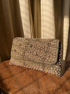 Front view of the Moonbeam Crystal flap bag, showcasing its brilliant, sparkling surface.
