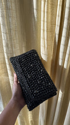 Detailed view of the light reflection off the multi-faceted crystals of the Moonbeam bag.