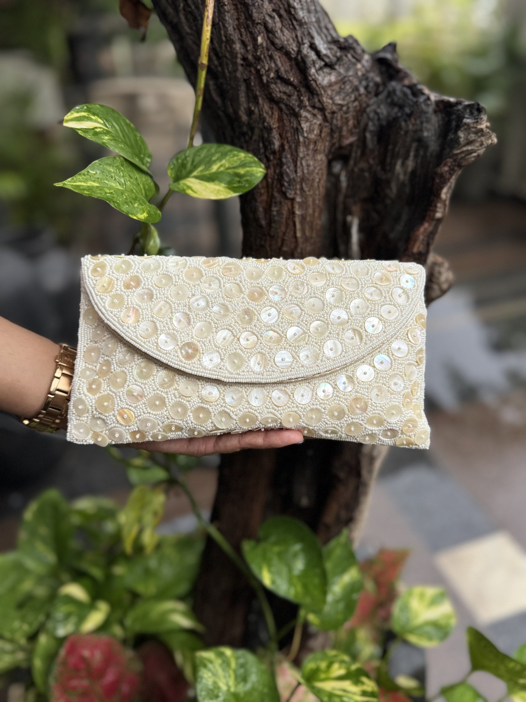 Front view of the Ocean's Grace flap bag, showing the symmetry and layout of the wave stitches.