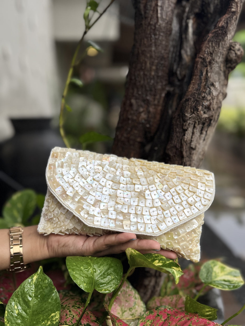 Side profile of the Ocean's Grace clutch, illustrating its sleek, elongated rectangular depth.