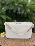 Detailed close-up of the delicate pastel weave and texture.