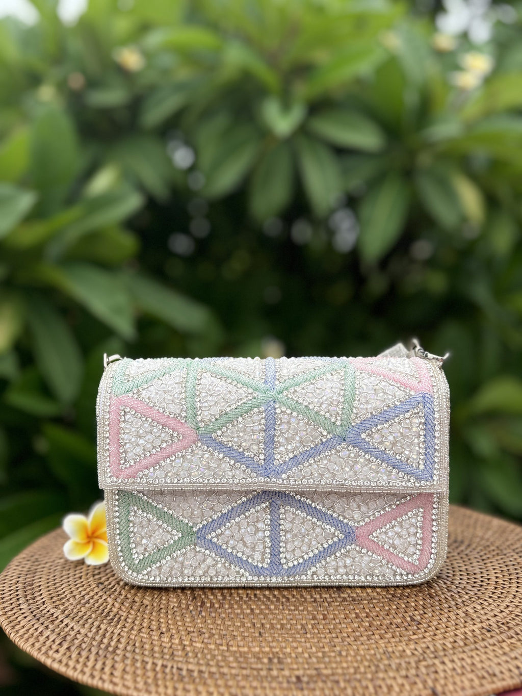 Top view of the Pastella clutch showing the clasp opening and gold hinge.