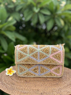 Model styling the Pastella clutch handheld with a floral summer dress.