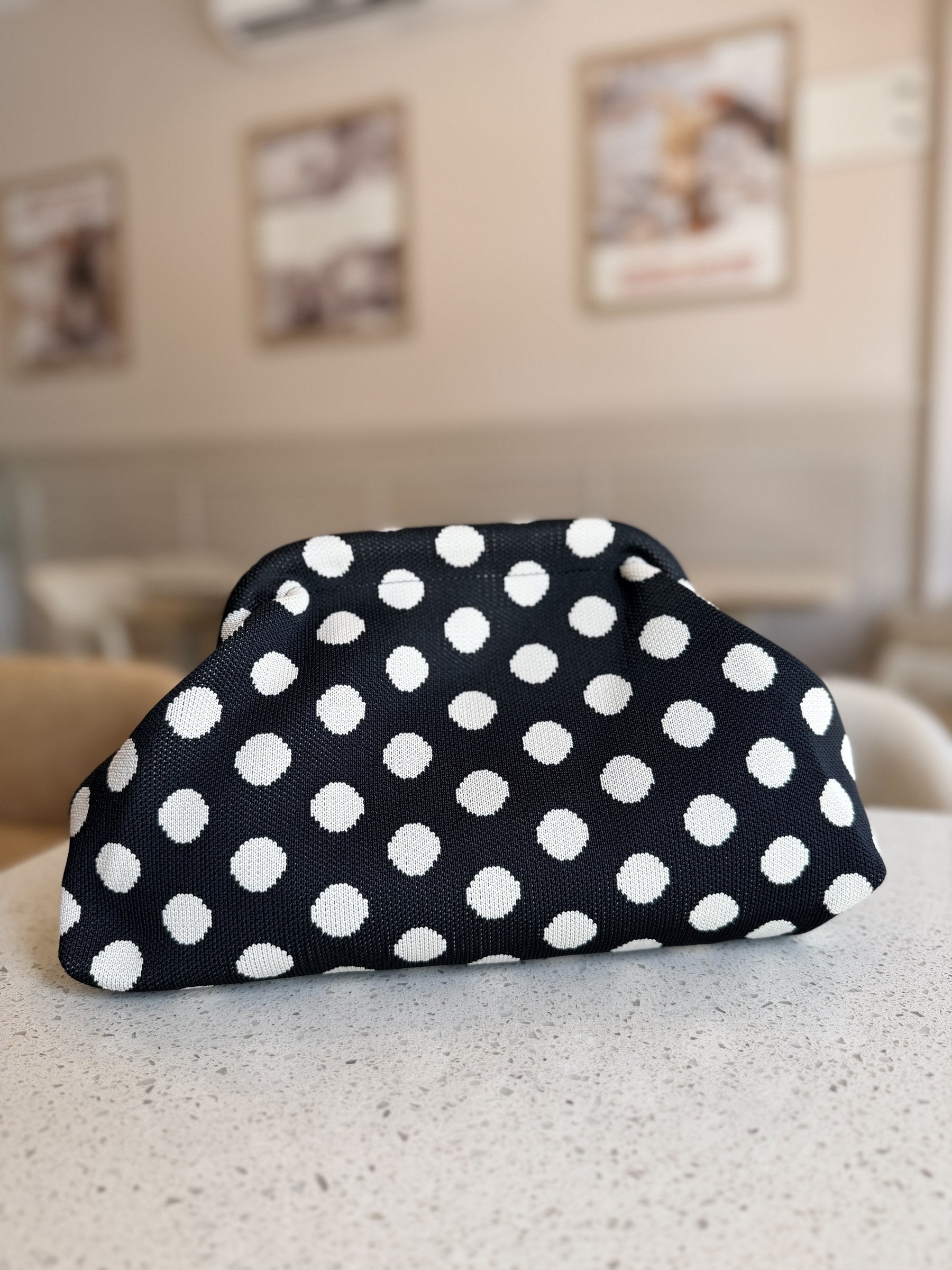 Pattern Play bag styled next to travel coordinates in a flat lay.
