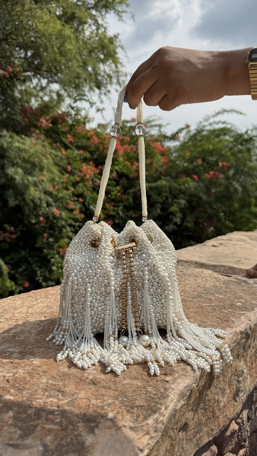 Front view of the Perla All-Over Pearl Statement Bag displaying its dense pearlescent surface and rectangular silhouette.