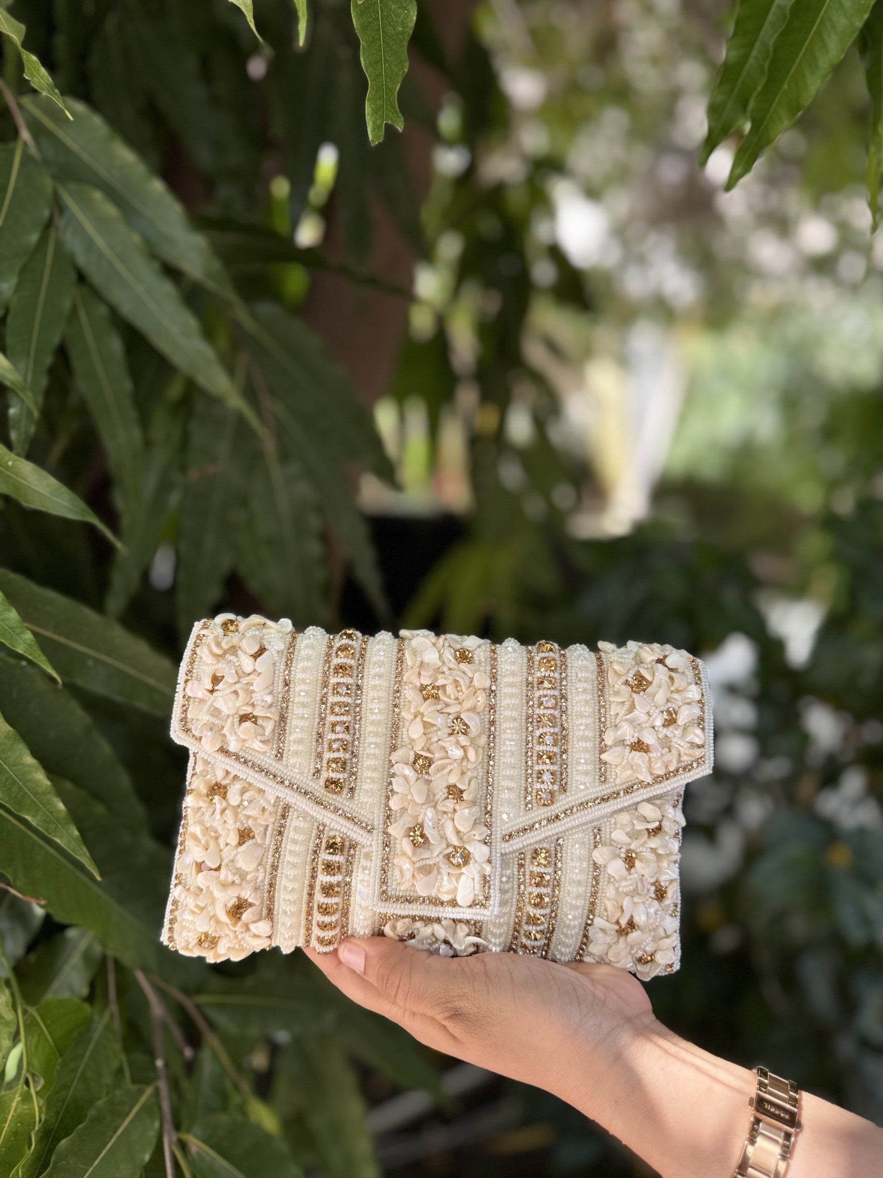 Front view of the Riwayat Fold bag, highlighting the symmetry of its handcrafted heritage work.